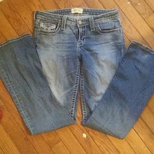 A pair of dark stone washed Big Star bootcut jean.